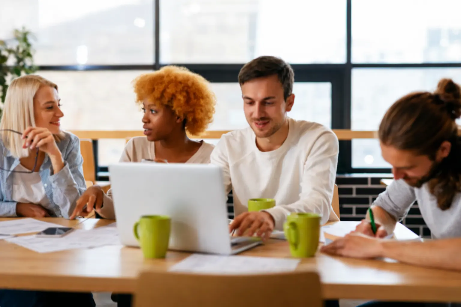 Training workshop with professionals collaborating at a table